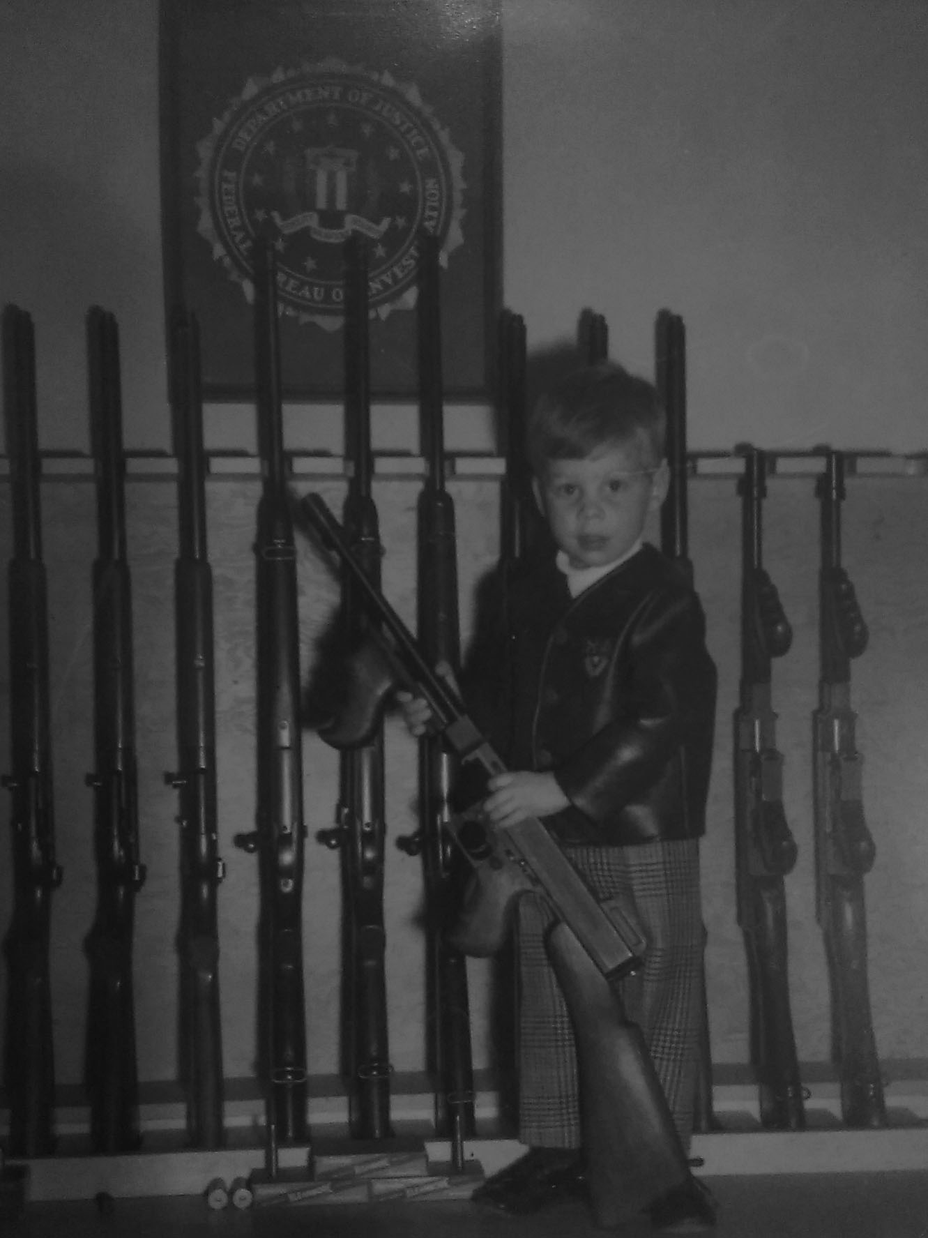 I was five years old when I went to the FBI weapons cache in Portland, Oregon. The Tommy gun I was holding was as tall as I was. I remember having to prop it on my foot to hold its weight.